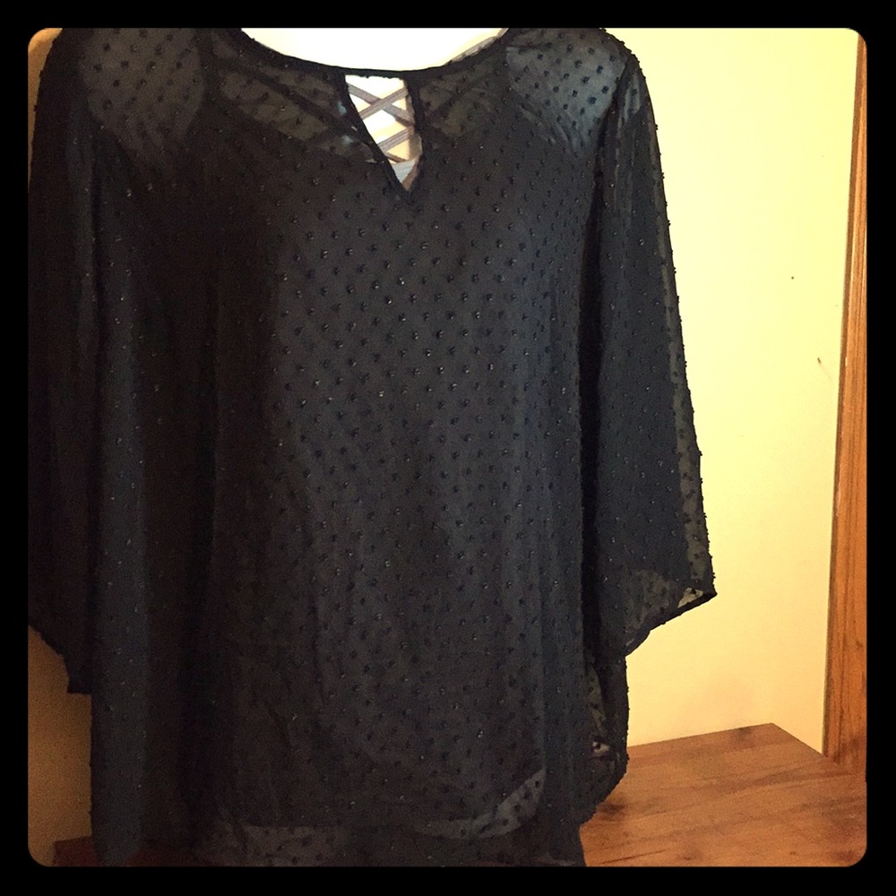 All black see-through blouse.